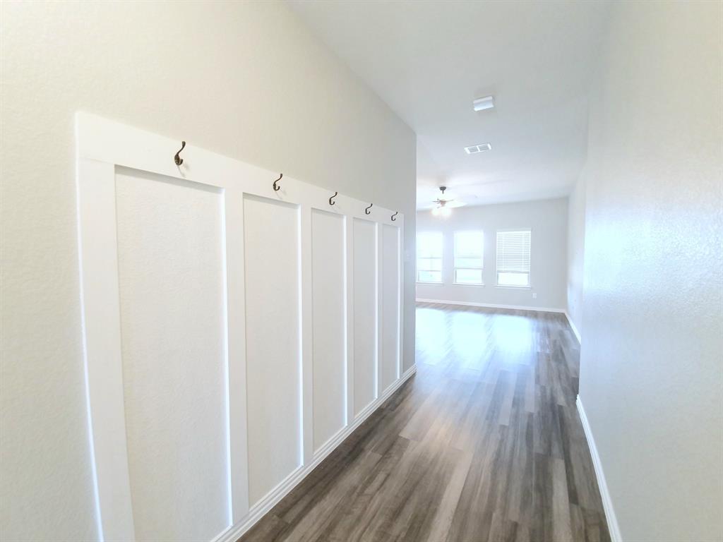 822 Spruce Lane Princeton, TX 75407 - Photo 6 of 35 a view of a room with wooden floor and window