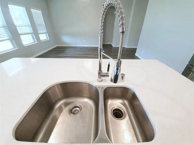 a bathroom with a sink and mirror