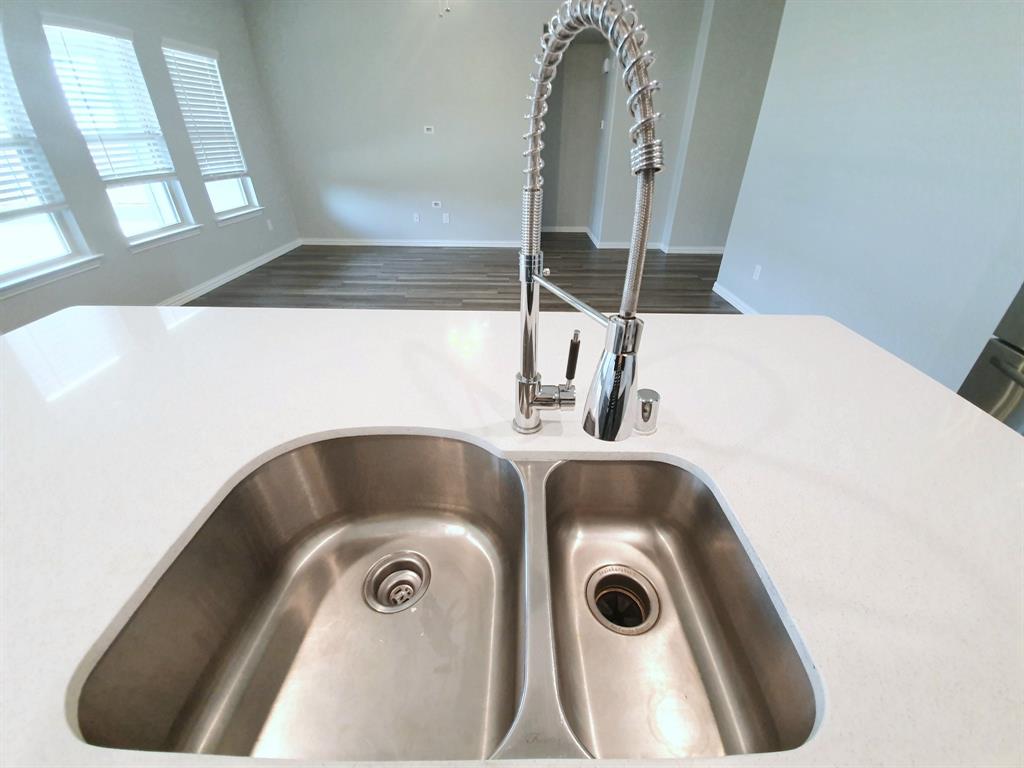 822 Spruce Lane Princeton, TX 75407 - Photo 10 of 35 a bathroom with a sink and mirror