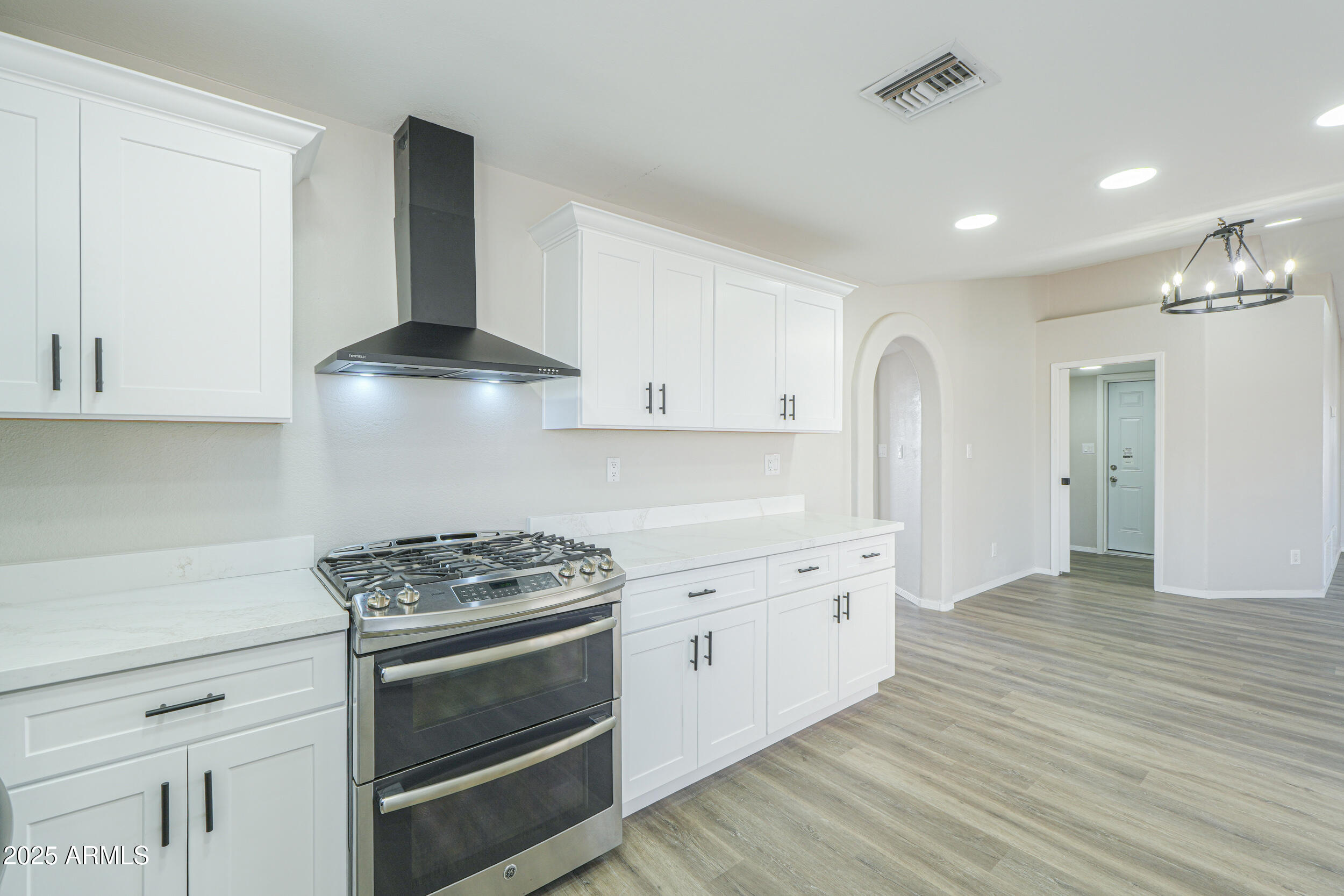 15741 Coral Road Arizona City, AZ 85123 - Photo 11 of 32 a kitchen with granite countertop a stove and a sink
