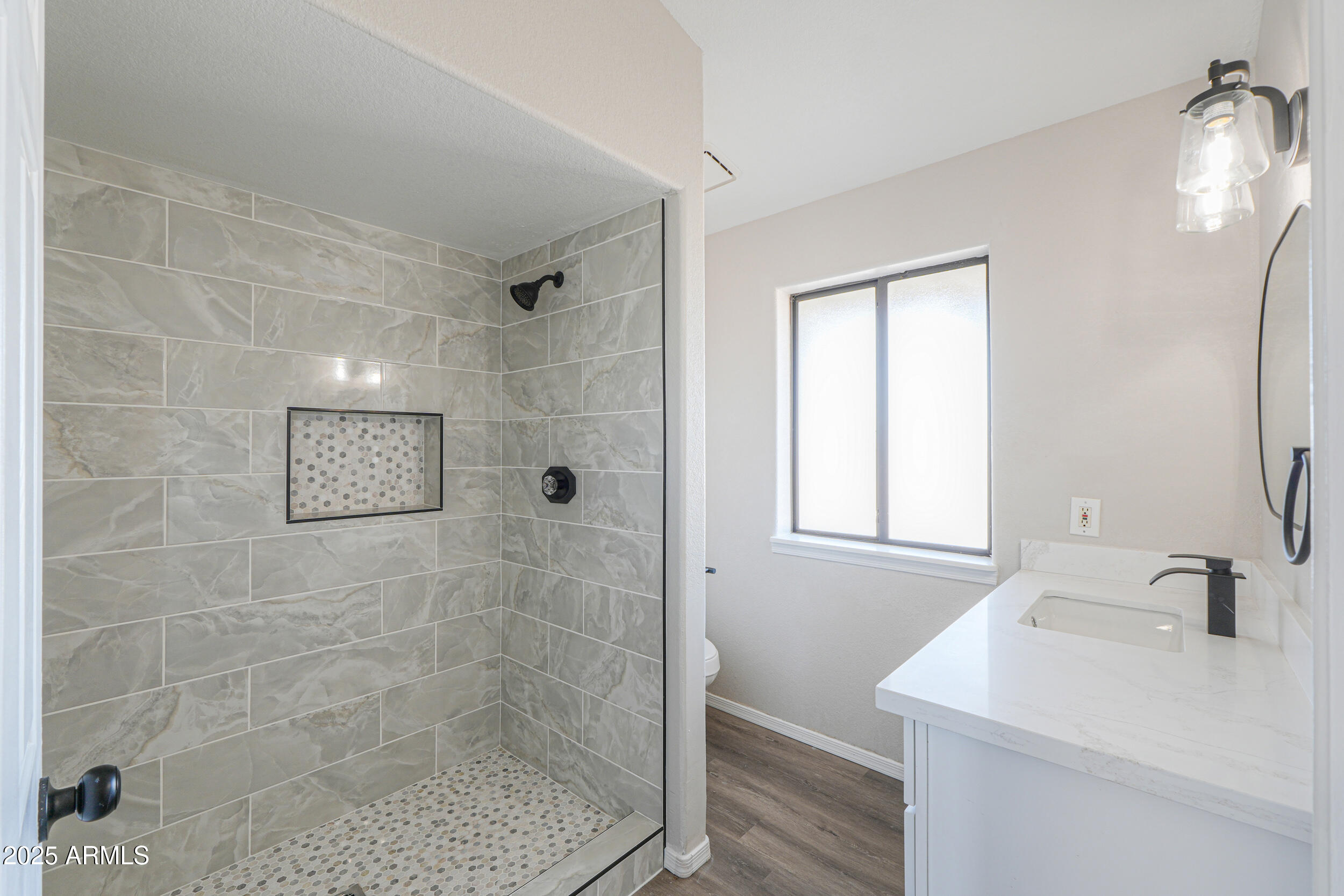 15741 Coral Road Arizona City, AZ 85123 - Photo 20 of 32 a bathroom with a sink a shower and a mirror