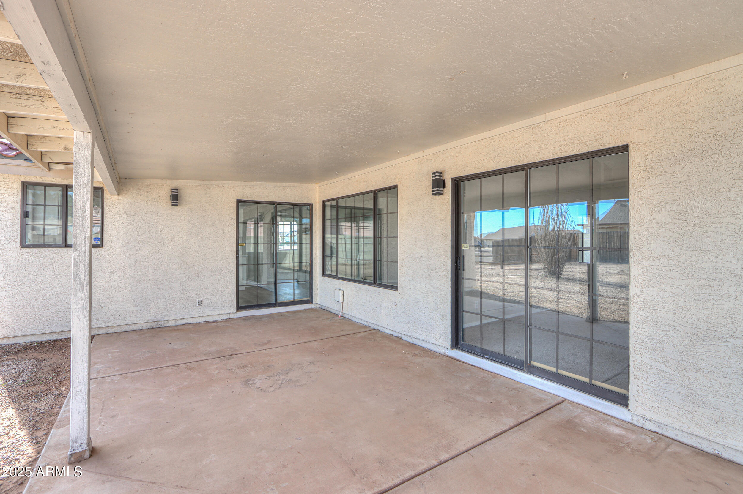 15741 Coral Road Arizona City, AZ 85123 - Photo 26 of 32 a view of an empty room with glass door