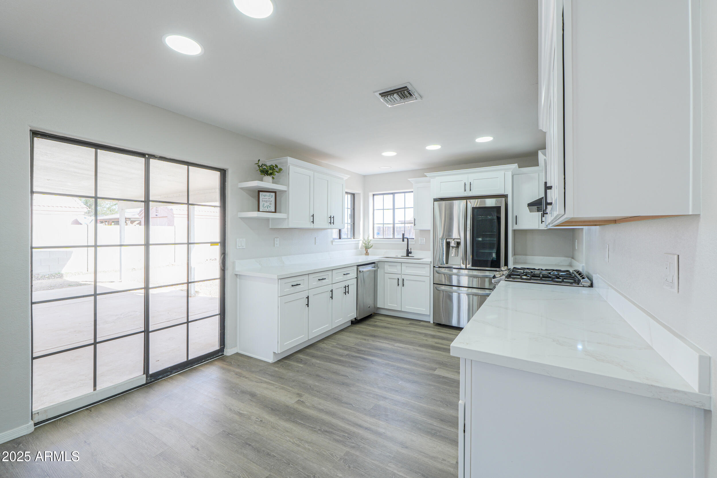 15741 Coral Road Arizona City, AZ 85123 - Photo 9 of 32 a kitchen with appliances cabinets and a sink