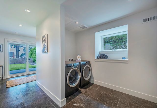a view of a storage & utility room with washer and dryer