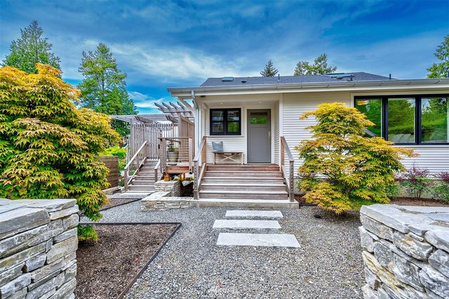a view of a building with potted plants