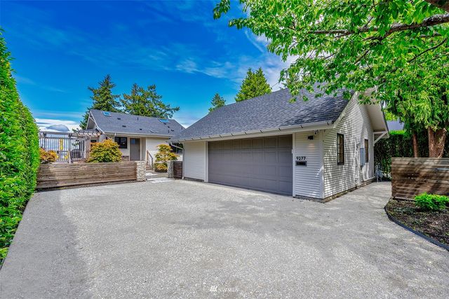 a view of a house with a garage and a garage