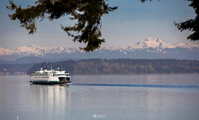 a view of a lake with sunset