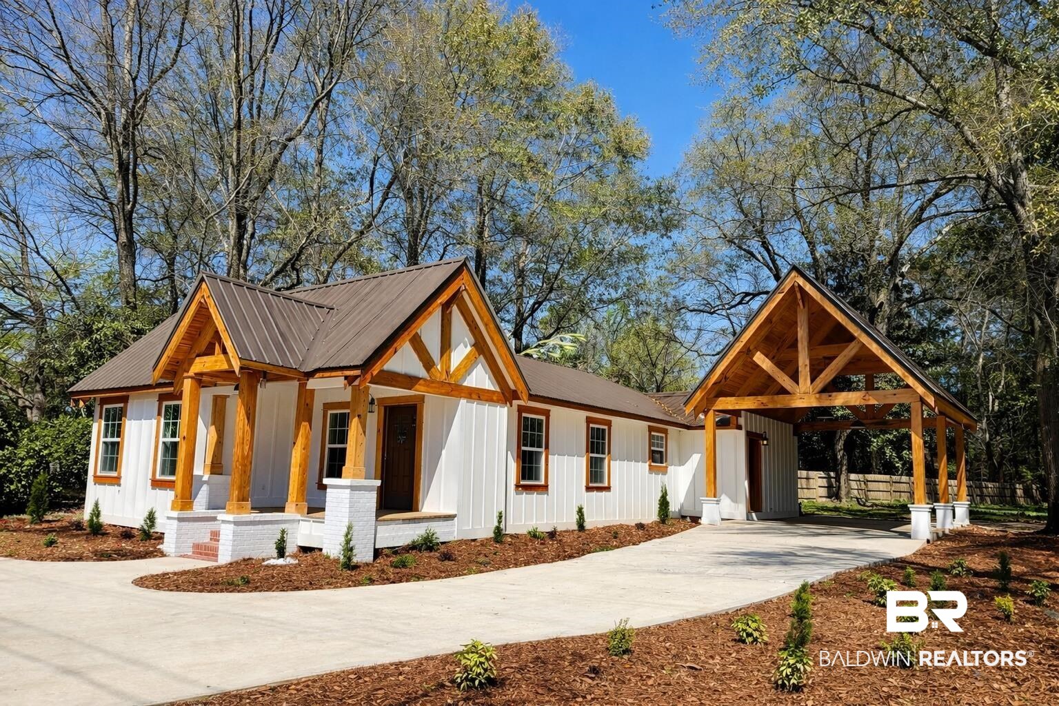 613 Forrest Avenue Brewton, AL 36426 - Photo 1 of 22 Modern inspired farmhouse featuring board and batten siding, concrete driveway, a carport, a metal roof, and covered porch