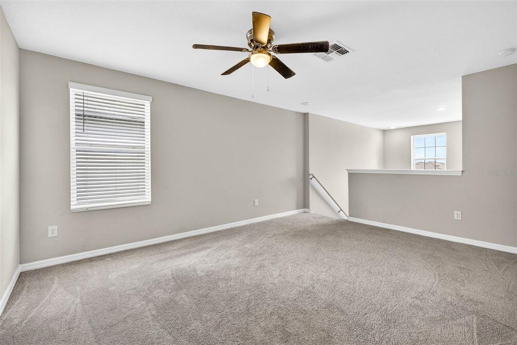 9616 Lemon Drop Loop Sun City Center, FL 33573 - Photo 30 of 53 a view of an empty room with a window