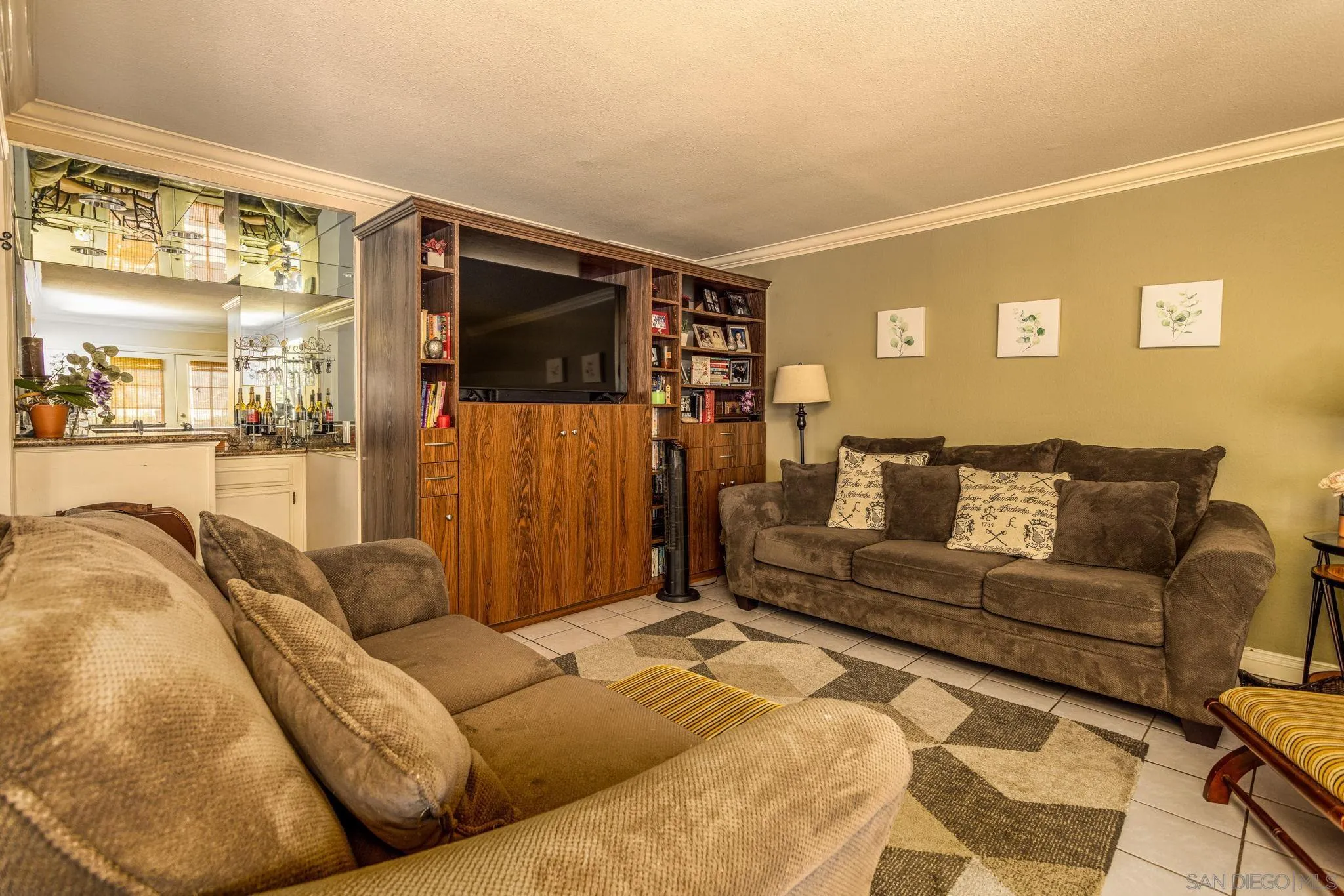 4648 Valley Glen Drive Corona, CA 92878 - Photo 11 of 42 a living room with a couch and a flat screen tv