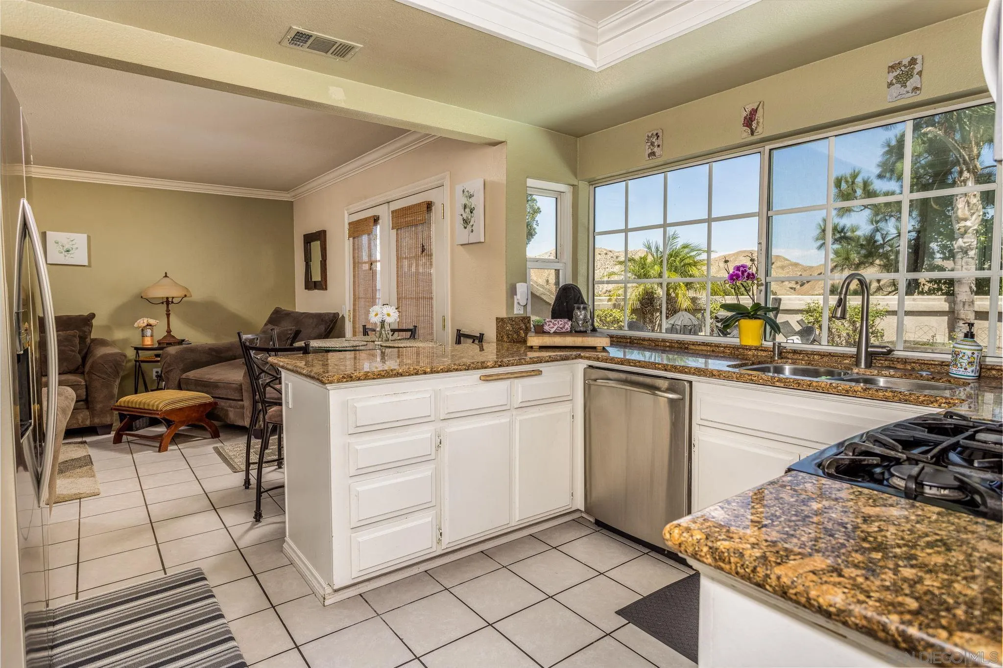 4648 Valley Glen Drive Corona, CA 92878 - Photo 14 of 42 a kitchen with a sink and cabinets