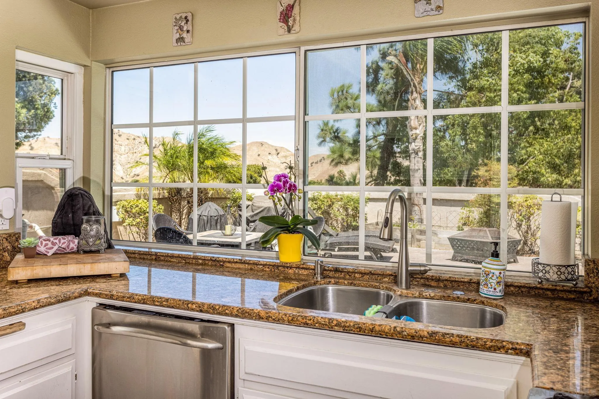 4648 Valley Glen Drive Corona, CA 92878 - Photo 15 of 42 a kitchen with a sink and a large window