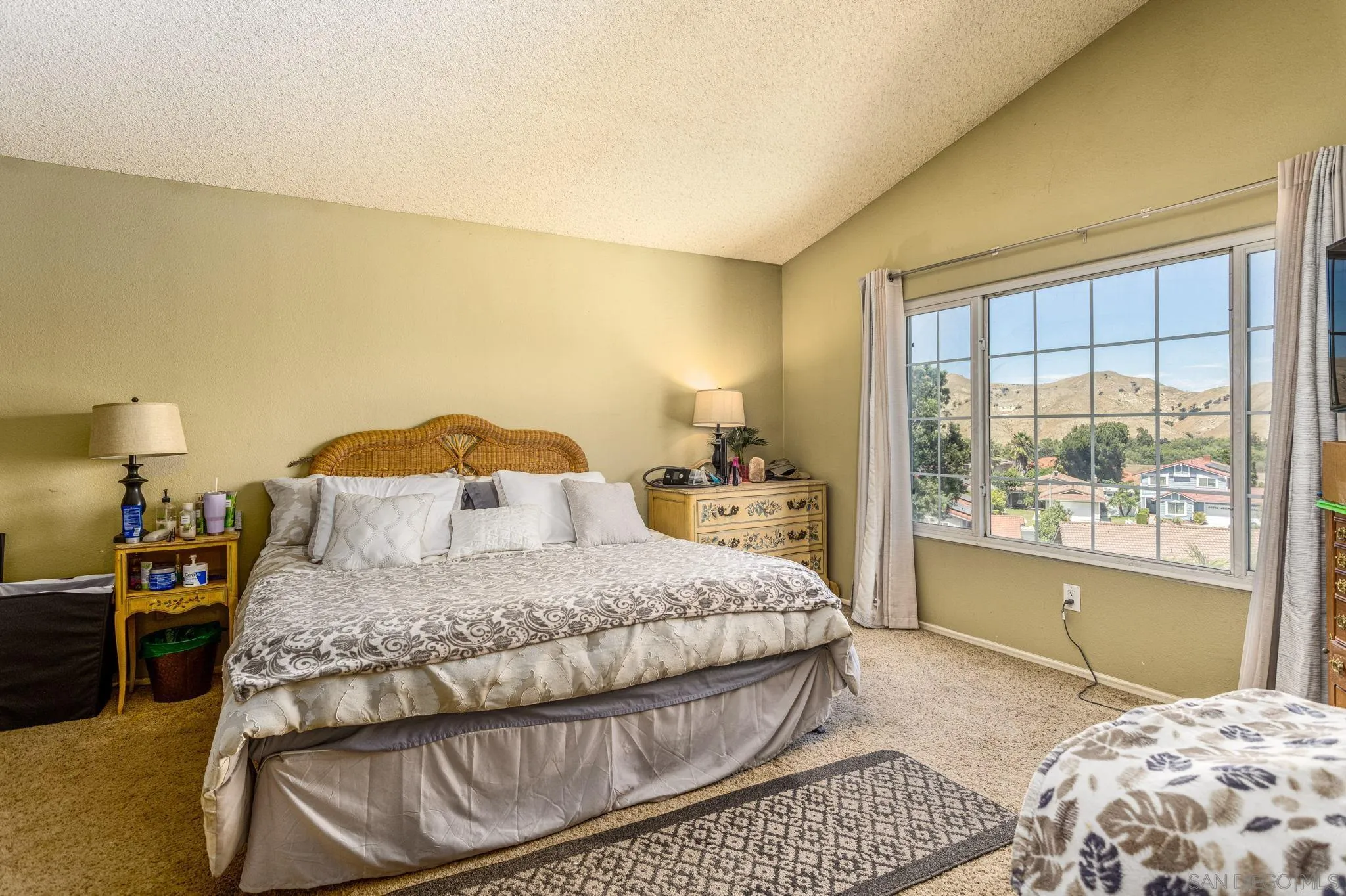 4648 Valley Glen Drive Corona, CA 92878 - Photo 24 of 42 a bedroom with a large bed and a window