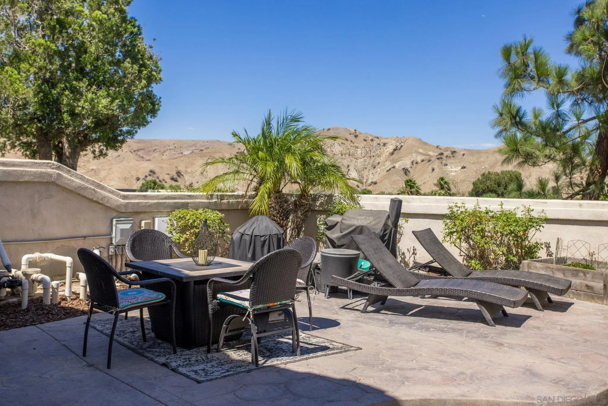 4648 Valley Glen Drive Corona, CA 92878 - Photo 29 of 42 a view of a chairs and table in patio