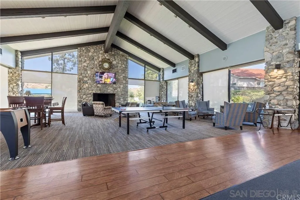 4648 Valley Glen Drive Corona, CA 92878 - Photo 35 of 42 a living room with fireplace furniture and a large window
