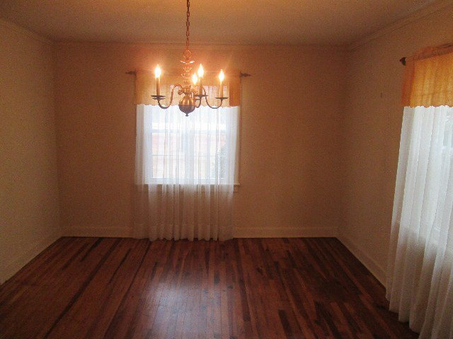 6121 Forsyth Road Macon, GA 31210 - Photo 13 of 17 a view of a room with wooden floor and fan