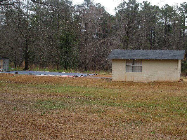 6121 Forsyth Road Macon, GA 31210 - Photo 4 of 17 a view of outdoor space with deck and yard