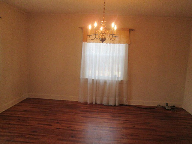 6121 Forsyth Road Macon, GA 31210 - Photo 8 of 17 a view of a room with wooden floor and window