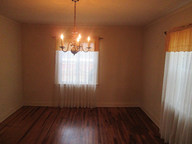 6121 Forsyth Road Macon, GA 31210 - Photo 9 of 17 a view of a room with wooden floor and windows