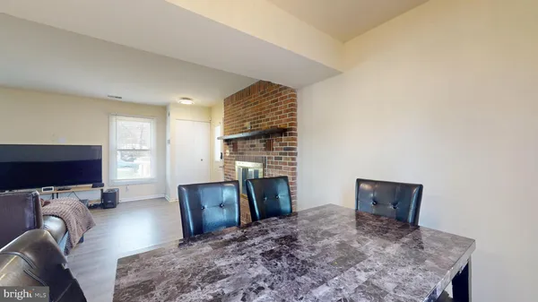 a view of a livingroom with furniture and a flat screen tv