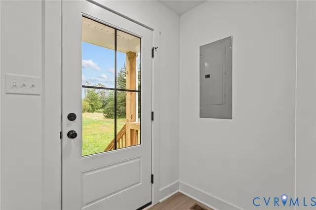 a view of a hallway with a room