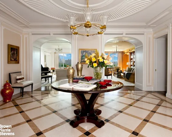 a living room with dining table and chairs