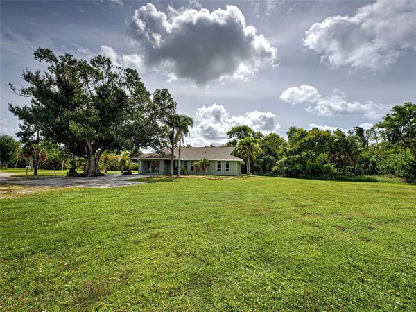 a view of a house with a big yard