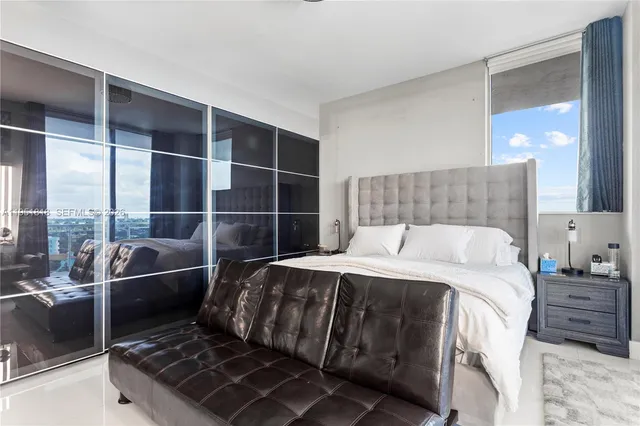 a bed room with a bed and a window