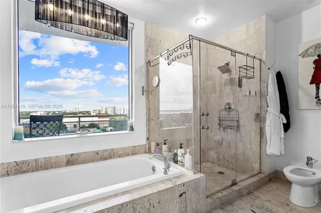 a bathroom with a bathtub and a shower