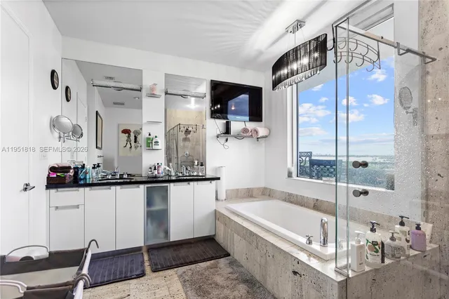 a bathroom with a bathtub and a sink