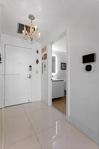 a bathroom with a toilet a sink a mirror and vanity