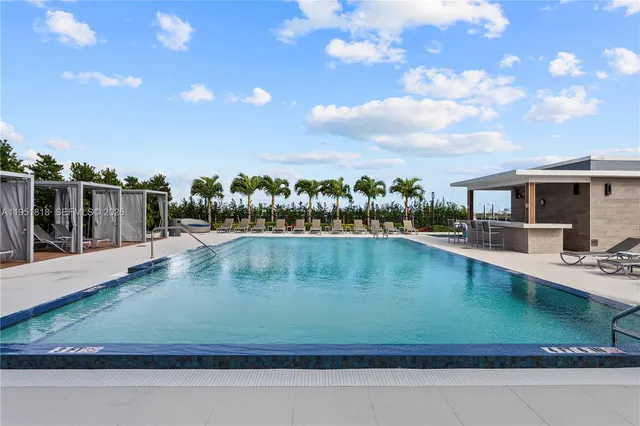 a view of a patio with a table and chairs