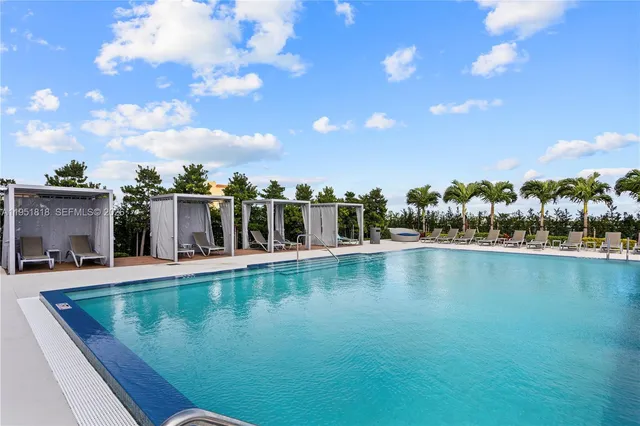 a view of a chairs and table in a backyard
