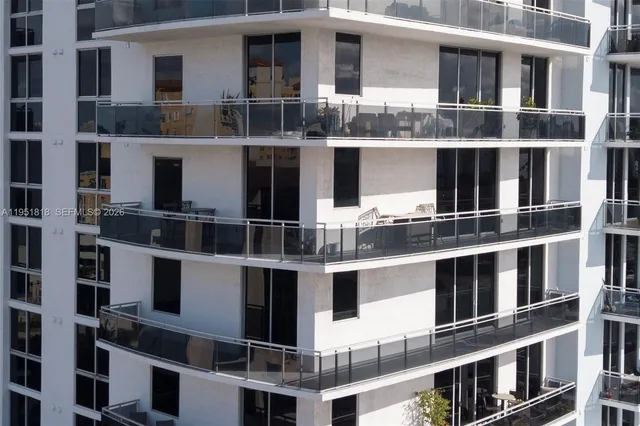 a front view of a building with many windows