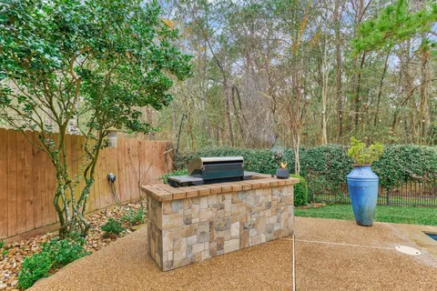 a view of a garden filled with furniture