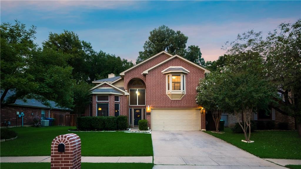 2724 Ridgemere Drive Flower Mound, TX 75028 - Photo 1 of 1 a front view of a house with a garden and yard
