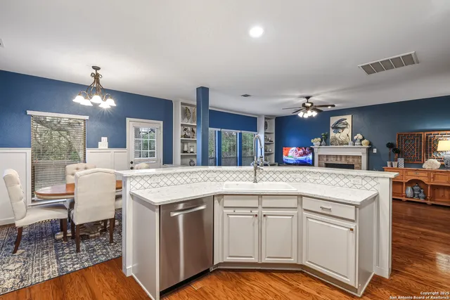 a kitchen with a stove and cabinets