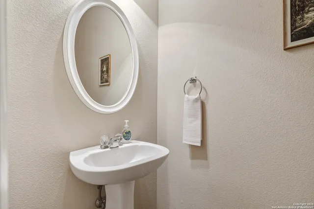 a bathroom with a sink and a mirror