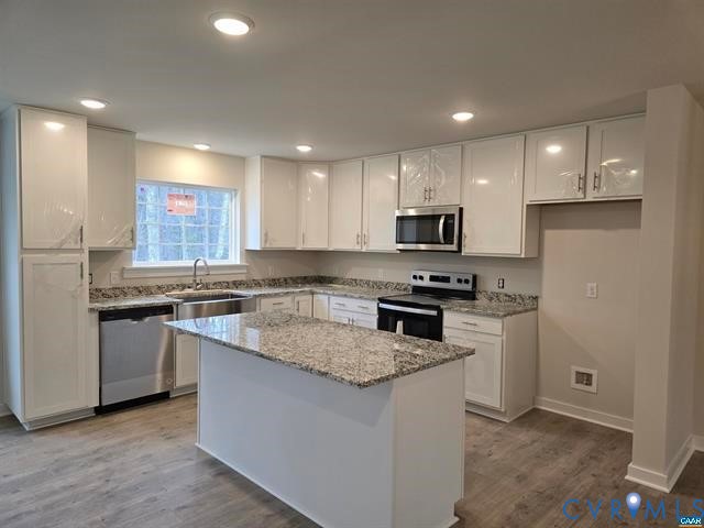 1337 Salem Church Road Palmyra, VA 22963 - Photo 21 of 21 a kitchen with a sink stove top oven and refrigerator