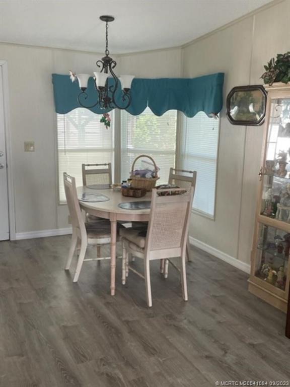 2526 Southwest Olds Place Stuart, FL 34997 - Photo 4 of 11 a view of a dining room with furniture and wooden floor