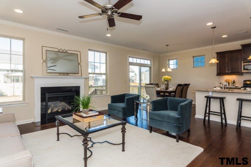 4221 Fares Wall Court Raleigh, NC 27616 - Photo 11 of 25 a living room with furniture and a fireplace