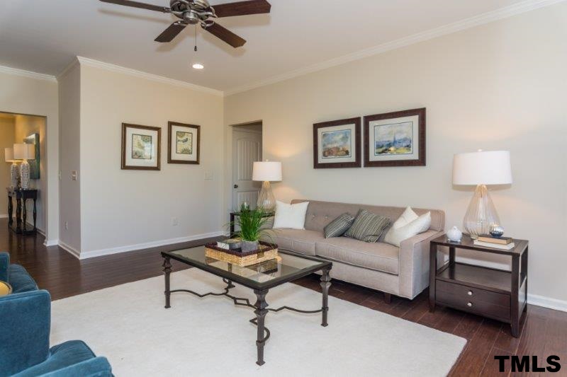 4221 Fares Wall Court Raleigh, NC 27616 - Photo 13 of 25 a living room with furniture and a lamp