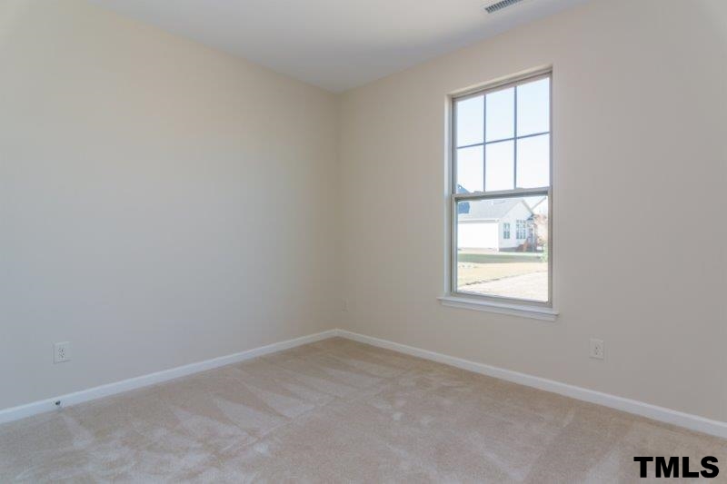 4221 Fares Wall Court Raleigh, NC 27616 - Photo 14 of 25 an empty room with a window