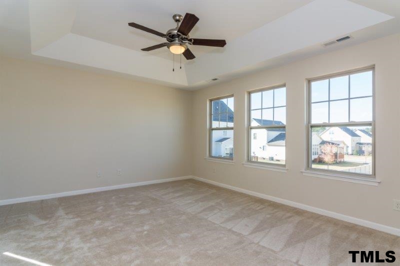 4221 Fares Wall Court Raleigh, NC 27616 - Photo 16 of 25 an empty room with windows and fan