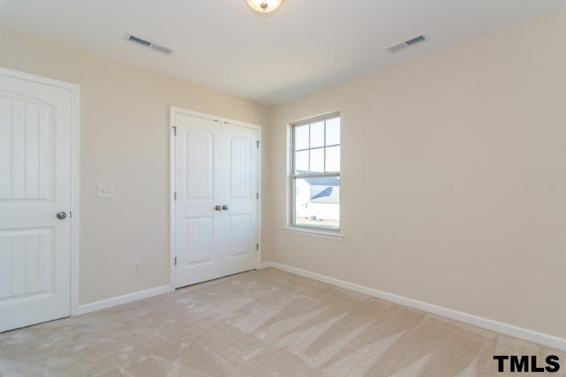4221 Fares Wall Court Raleigh, NC 27616 - Photo 20 of 25 a view of an empty room with a window