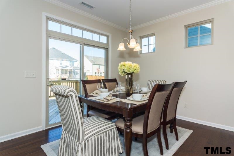 4221 Fares Wall Court Raleigh, NC 27616 - Photo 5 of 25 a view of a dining room with furniture window and wooden floor