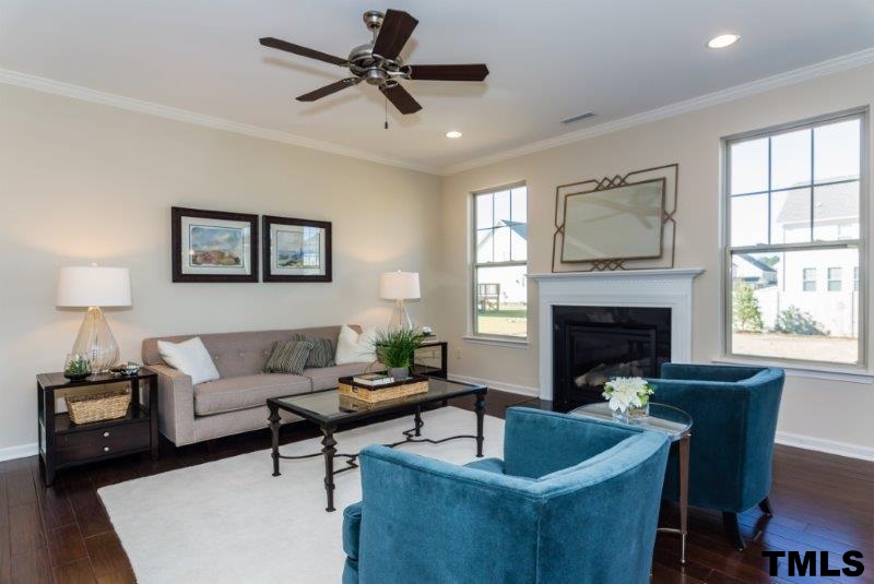 4221 Fares Wall Court Raleigh, NC 27616 - Photo 10 of 25 a living room with furniture and a fireplace