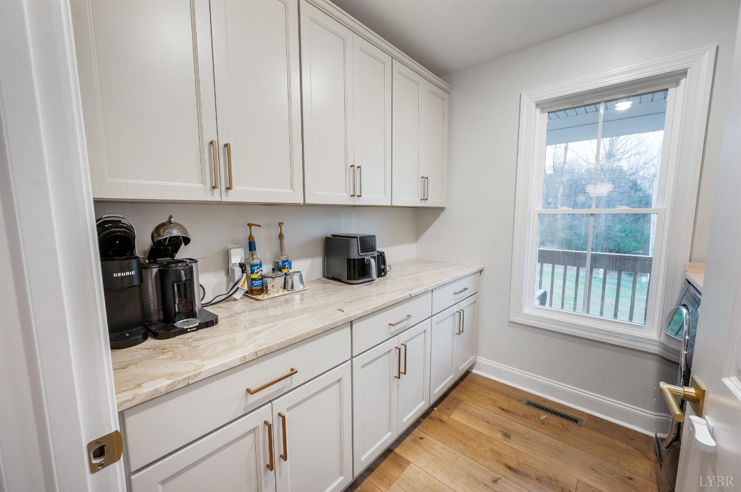 240 Ned Brown Road Amherst, VA 24521 - Photo 20 of 53 a kitchen with granite countertop white cabinets and white appliances
