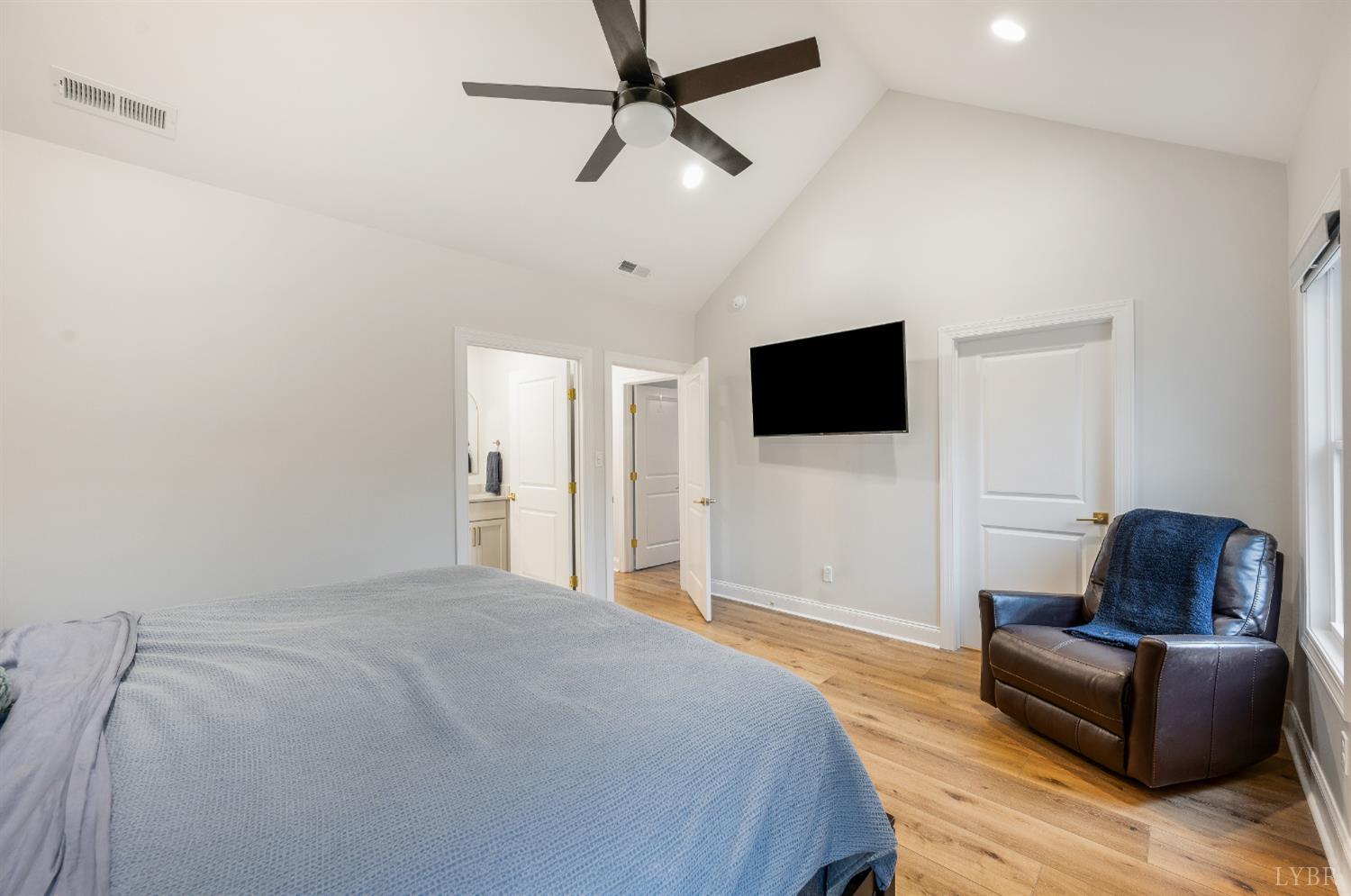 240 Ned Brown Road Amherst, VA 24521 - Photo 25 of 53 a bedroom with a bed window and a flat screen tv