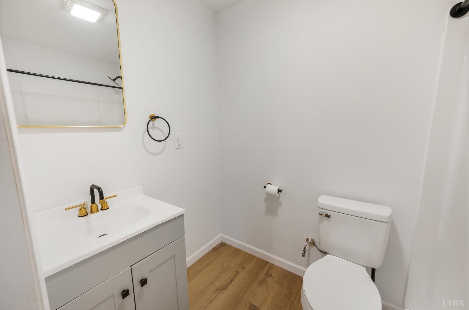 240 Ned Brown Road Amherst, VA 24521 - Photo 40 of 53 a bathroom with a toilet sink and mirror